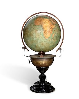 A Kelmer terrestrial table globe on metal stand
