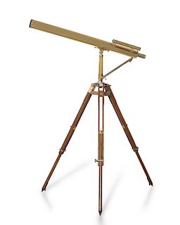 A brass telescope on adjustable oak folding stand