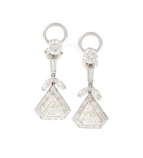 A pair of diamond and platinum dangle earrings