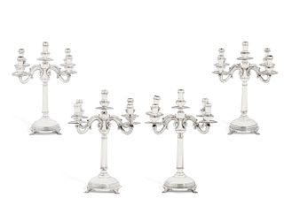 A set of four Peruvian sterling silver candelabra