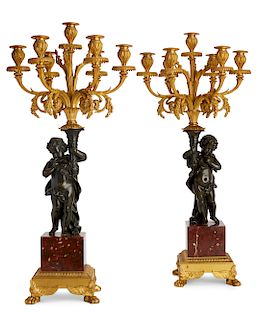 A pair of Louis XVI style figural candelabra