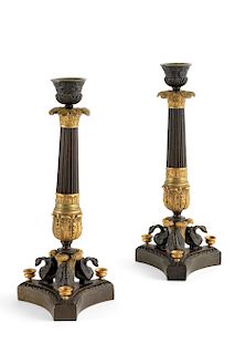 A pair of French bronze candlesticks 