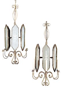 A pair of metal and mirrored glass chandeliers