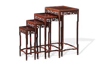 A set of Chinese carved hardwood quartetto tables