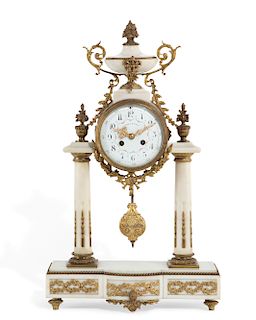 A Louis XVI style white marble mantel clock