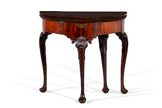 A George II carved walnut fold over games table