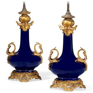 A pair of Louis XV style porcelain vase lamps