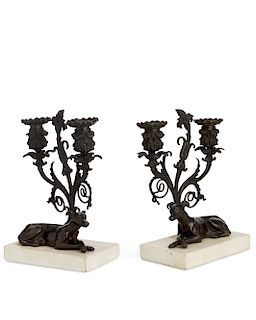 A pair of Neoclassical bronze dog form candelabra