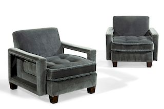 A pair of teal upholstered armchairs