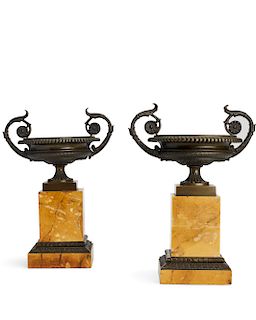 A pair of Charles X bronze and marble urns