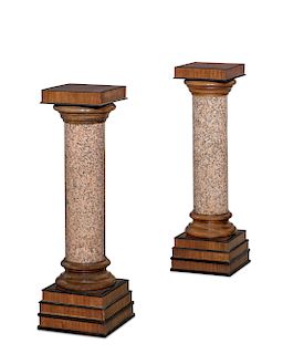 A pair of  granite and walnut pedestals