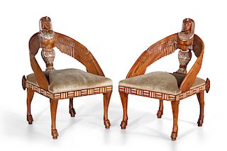 A pair of Egyptian Revival armchairs