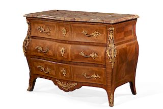 A Louis XV style gilt bronze mounted commode