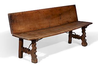 A Spanish Baroque wrought iron and walnut bench