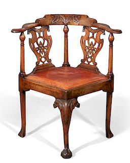 A George II walnut corner armchair, Gillows