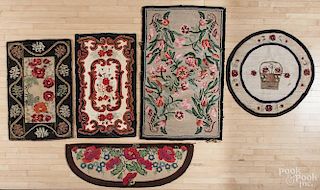 Five floral hooked rugs, late 19th/early 20th c., to include a rectangular rug