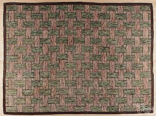 Roomsize American hooked rug, early 20th c., with a basket weave pattern, 99 3/4'' x 130''.