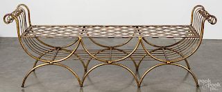 Classical-style iron garden bench, early 20th c., with a mesh seat, retaining an old gilt surface