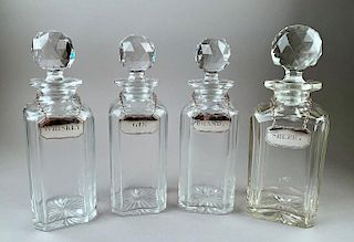 Four English Crystal Decanters with British Silver Tags
