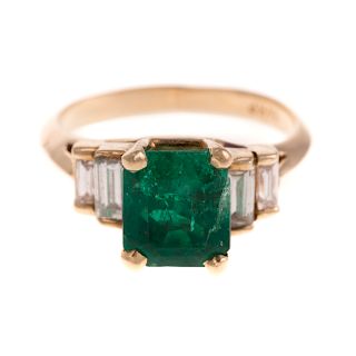 A Ladies 14K Fine Emerald and Diamond Ring