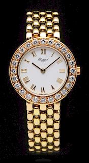 Ladies 18K Gold Chopard Diamond Wrist Watch.