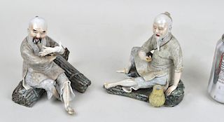 Two Asian Porcelain Seated Figures