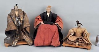 Three Asian Male Figures on Stands