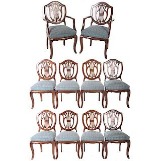 Juego de 8 sillas y 2 sillones. Siglo XX. En talla de madera. Con tapicería de tela lineal color azul Respaldo semiabierto.