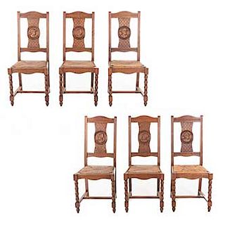 Lote de 6 sillas. Francia. Siglo XX. Estilo Bretón. En talla de madera de roble. Con respaldo semiabierto, asientos de palma.