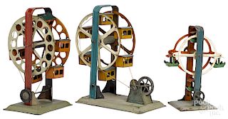 Three painted tin Ferris wheel steam toy accessories
