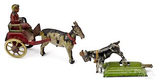 Two tin lithograph goat penny toys