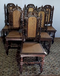 MATCHED SET OF 12 EUROPEAN OAK AND CANE CHAIRS