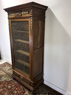 FRENCH WALNUT AND PARTIAL GILT BIBLIOTHEQUE