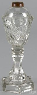 Colorless glass whale oil lamp, 19th c., with heart panels, 9 1/4'' h.