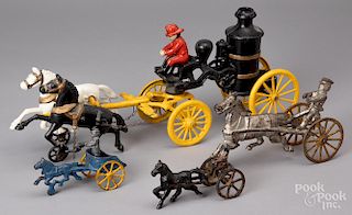 Three cast iron horse drawn carts, etc.