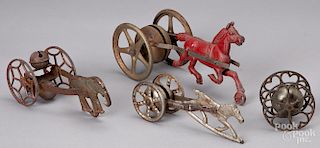 Four cast iron bell toys