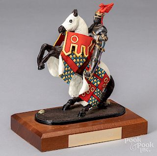 Cast metal miniature soldier on horseback