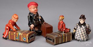 Four wind-up and friction porter toys