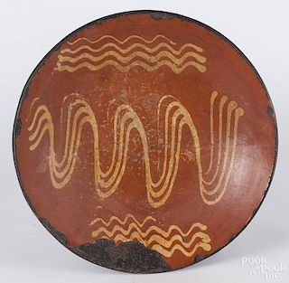 Large redware charger, 19th c., with yellow slip decoration, 15 1/4'' dia.