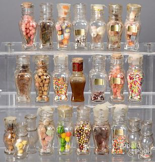 Twenty-four miniature glass spice/candy bottles
