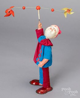 Celluloid wind-up twirling clown