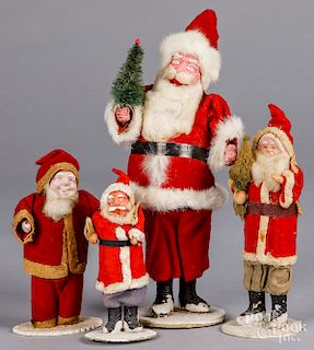 Four Japanese composition Santa Claus figures