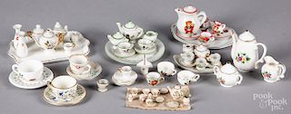 Six porcelain doll house tea services