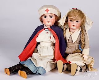 Two German bisque red cross dolls