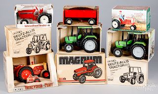 Nine boxed Ertl die cast tractors