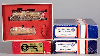 Three brass HO scale train cars and locomotives
