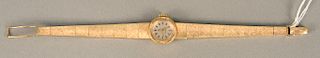 Omega 14 karat gold ladies wristwatch with 14 karat gold bracelet. lg. 6 1/2 in., 27.7 grams total weight