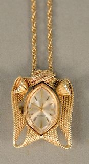 LeCoultre ladies 14 karat gold pendant watch on 14 karat gold chain. chain lg. 24 in., 16.9 grams total weight
