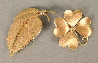 Two 14 karat gold pins, flower and leaf. lg. 2 1/8 in., dia. 1 3/8 in., 13 grams total weight