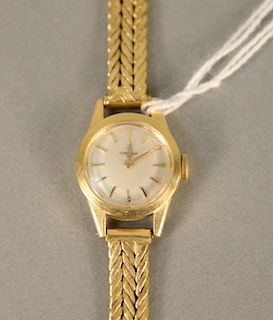 Omega 18 karat gold ladies wristwatch with 18 karat gold bracelet. lg. 6 1/8 in., 24.6 grams total weight